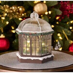 Illuminated Snow-Dusted Gazebo with Trees by Valerie